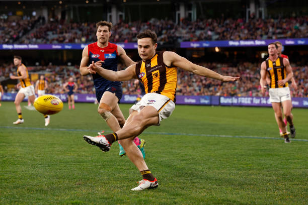 Karl Amon of the Hawks kicks the ball during the round 23 AFL match between Melbourne Demons and Hawthorn Hawks at Melbourne Cricket Ground, on...