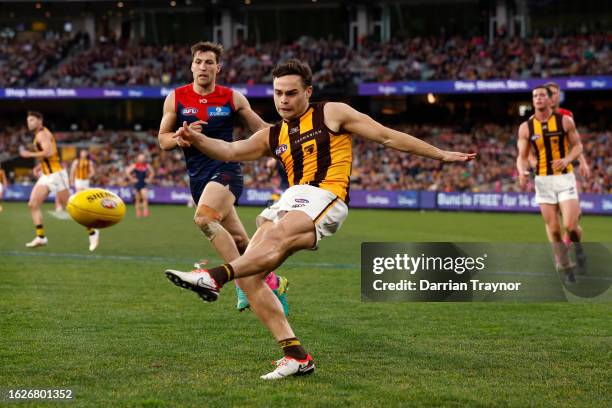 Karl Amon of the Hawks kicks the ball during the round 23 AFL match between Melbourne Demons and Hawthorn Hawks at Melbourne Cricket Ground, on...