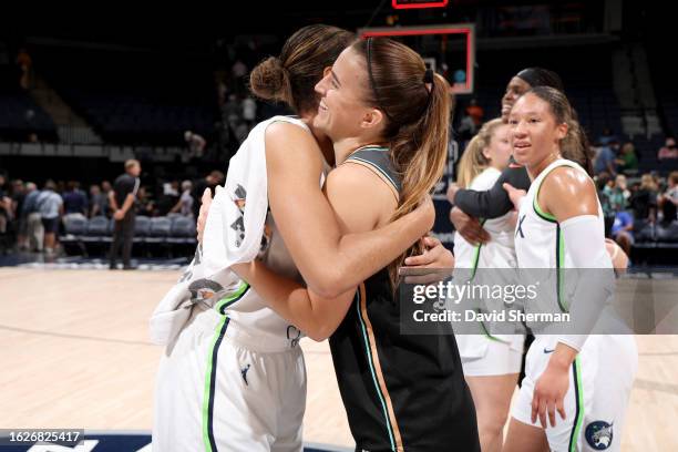 Napheesa Collier of the Minnesota Lynx and Sabrina Ionescu of the New York Liberty embrace after the game on August 26, 2023 at Target Center in...