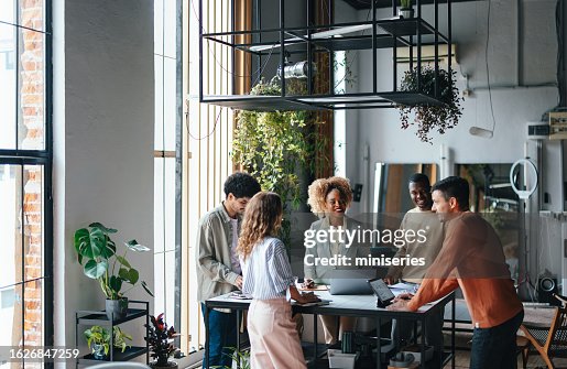 A Group Of Happy Multiethnic Businesspeople Working Together In The Office A Group Of Happy Multiethnic Businesspeople Working Together In The Office