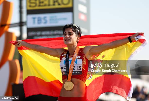 Maria Perez of Team Spain celebrates with a Spanish flag after winning the Gold Medal in the 20km Race Walk Women Final during day two of the World...