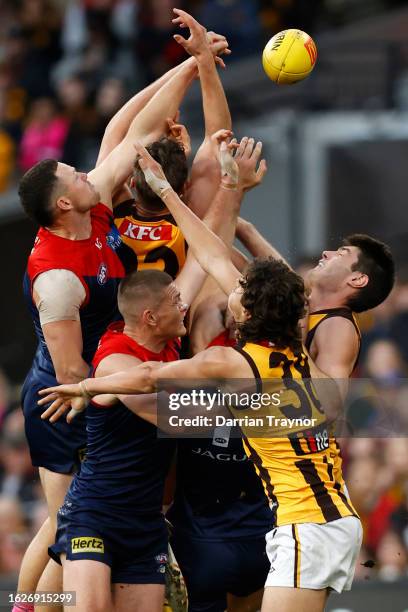 Steven May of the Demons spoils Jacob Koschitzke of the Hawks during the round 23 AFL match between Melbourne Demons and Hawthorn Hawks at Melbourne...