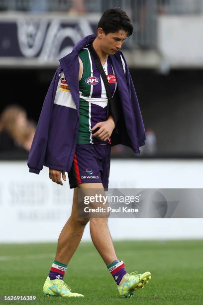 Bailey Banfield of the Dockers looks on with his left arm in a sling after being defeated during the round 23 AFL match between Fremantle Dockers and...