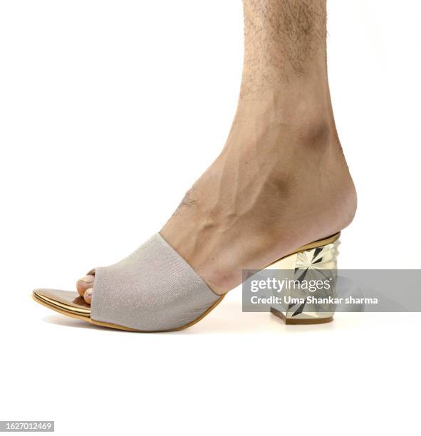 male foot in high heels. - male hair removal stock-fotos und bilder