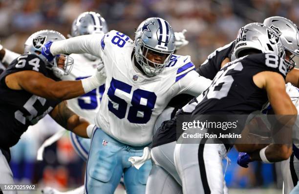 Mazi Smith of the Dallas Cowboys takes on the Las Vegas Raiders during the first half of a preseason game at AT&T Stadium on August 26, 2023 in...