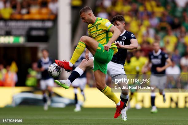 Ben Gibson of Norwich City and Kevin Nisbet of Millwall battle for possession during the Sky Bet Championship match between Norwich City and Millwall...