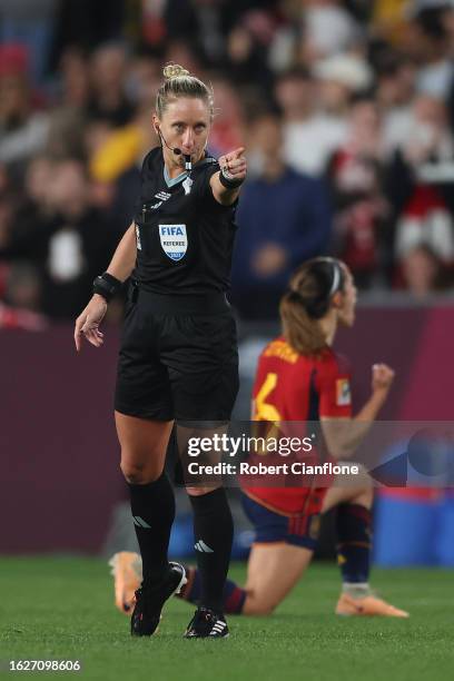 Referee Tori Penso points the penalty spot after the Video Assistant Referee review to award Spain a penalty kick during the FIFA Women's World Cup...