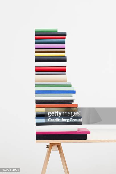 a stack of books on a table - pile of books white background stockfoto's en -beelden