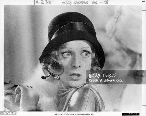 Maggie Smith looking to her left in a scene from the film 'Travels With My Aunt', 1972.
