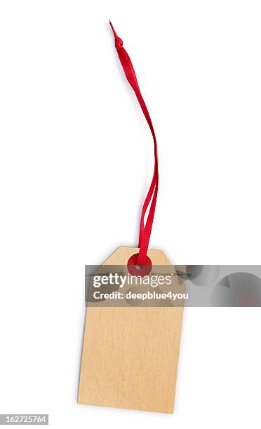 blank, cream-colored, price tag on a red cord. - clothing isolated stockfoto's en -beelden