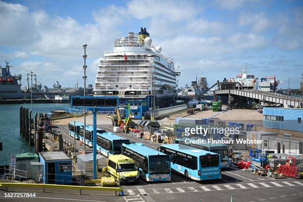 Passenger Shuttle Buses are seen in front of the cruise ship Spirit of Discovery, on August 20, 2023 in Portsmouth, England. After 18 months of...