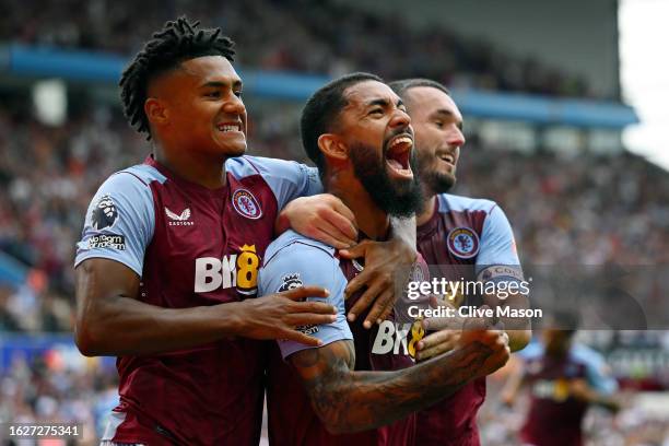 Douglas Luiz of Aston Villa celebrates with teammate Ollie Watkins after scoring the team's second goal from a penalty kick during the Premier League...