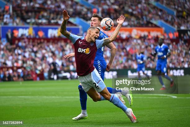 Lucas Digne of Aston Villa is challenged by Nathan Patterson of Everton during the Premier League match between Aston Villa and Everton FC at Villa...