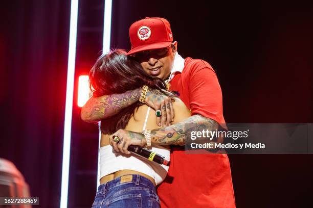 Ñengo Flow hugs a fan during the show as part of the fest 'Dale Mixx 2023' at Parque Fundidora on August 19, 2023 in Monterrey, Mexico.