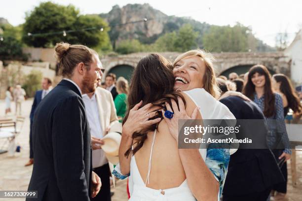 bride and mother embrace at wedding - marriage italian style stock pictures, royalty-free photos & images