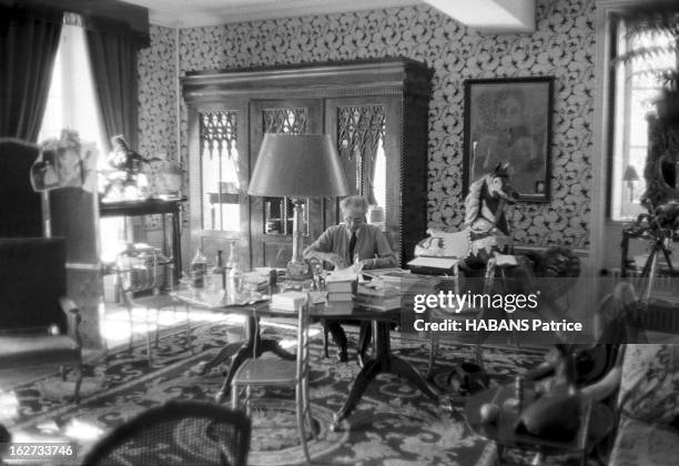 Jean Cocteau At Home In Milly La Foret. Milly-la-Forêt, mars 1960 : Jean COCTEAU reçoit l'équipe de 'Paris Match' dans sa gentilhommière : derrière...