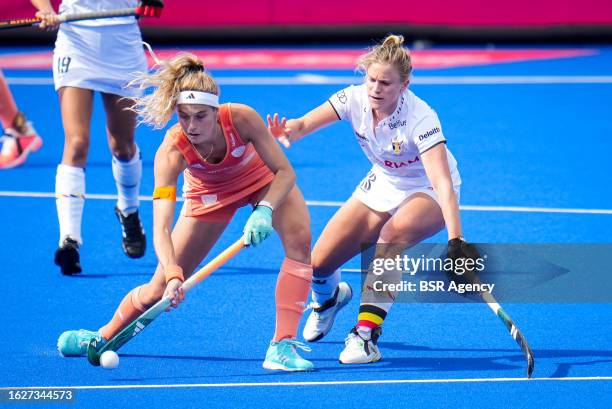 Yibbi Jansen of the Netherlands is challenged by Alix Gerniers of Belgium during the Women's EuroHockey Champions 2023 Final match between...