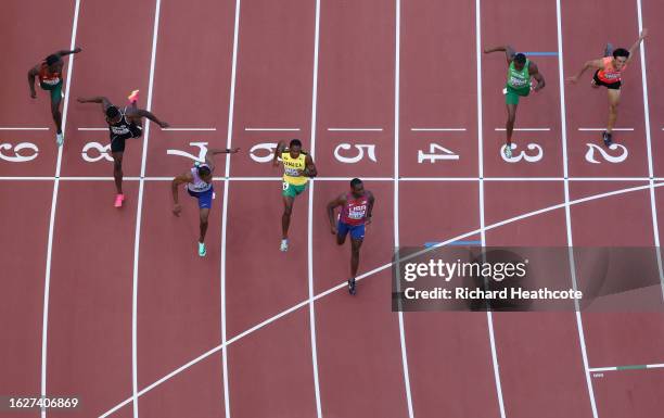 Zharnel Hughes of Team Great Britain, Ryiem Forde of Team Jamaica, and Christian Coleman of Team United States cross the finish line the Men's 100m...