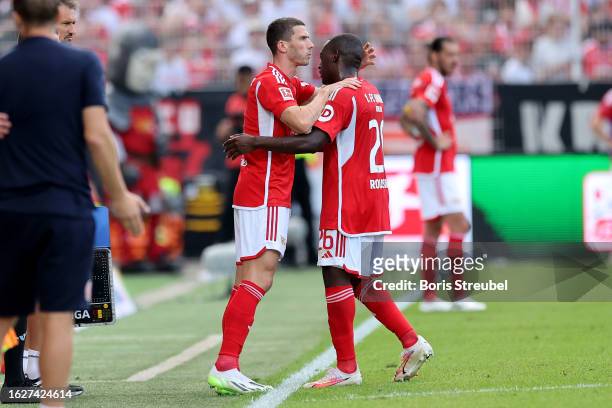 Jerome Roussillon of 1. FC Union Berlin is substituted for Robin Gosens of 1. FC Union Berlin during the Bundesliga match between 1. FC Union Berlin...