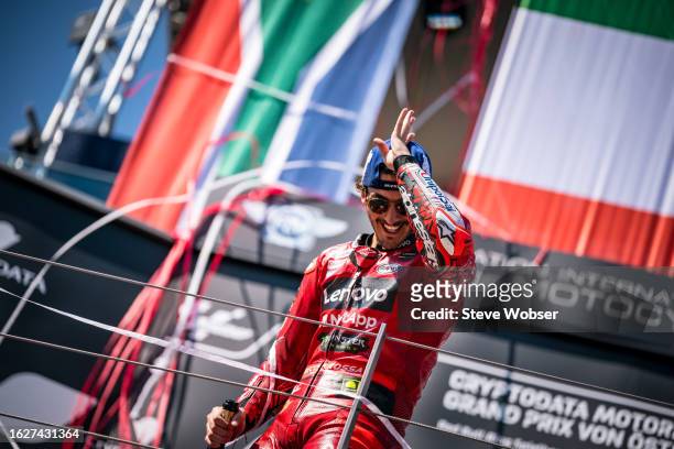 Francesco Bagnaia of Italy and Ducati Lenovo Team celebrates on the podium after his win during the Race of the MotoGP CryptoDATA Motorrad Grand Prix...