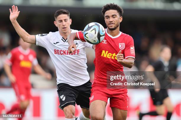 Nicolas Sessa of Verl challenges Bryan Hein of Regensburg during the 3. Liga match between SC Verl and Jahn Regensburg at Sportclub Arena on August...