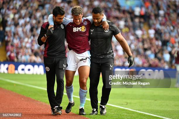 Philippe Coutinho of Aston Villa leaves the field after sustaining an injury during the Premier League match between Aston Villa and Everton FC at...