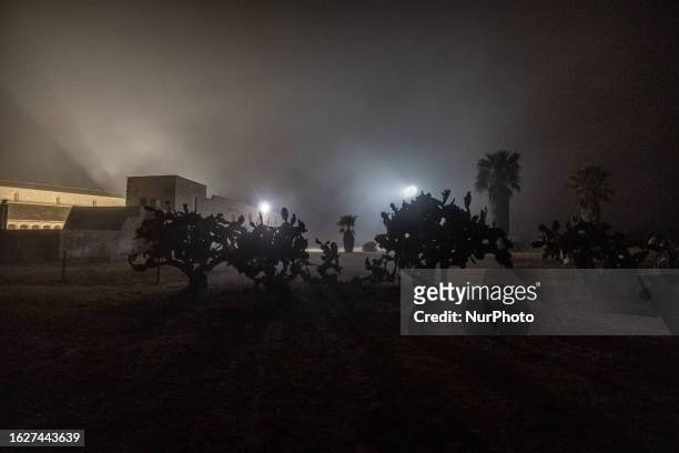Nighttime view of the Santa Maria di Cerrate Abbey enveloped in fog, located in Cerrate, Italy, taken on August 25, 2023. The abbey is one of the...