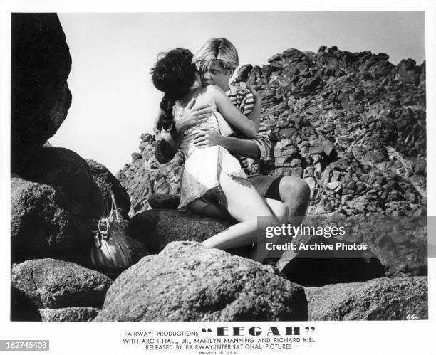 Marilyn Manning is hugged by Arch Hall Jr in a scene from the film 'Eegah', 1962.