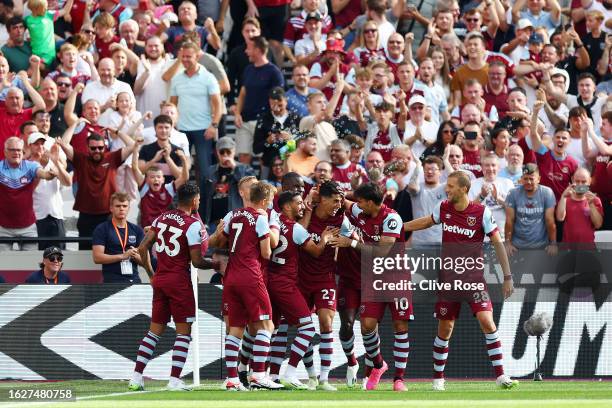 Nayef Aguerd of West Ham United celebrates with teammates after scoring the team's first goal during the Premier League match between West Ham United...