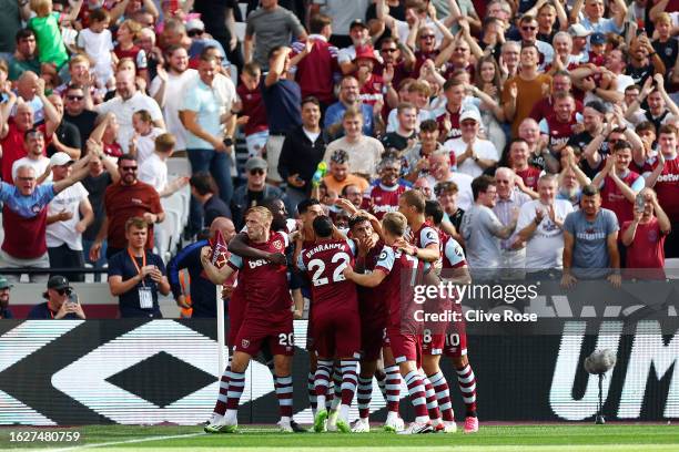 Nayef Aguerd of West Ham United celebrates with teammates after scoring the team's first goal during the Premier League match between West Ham United...