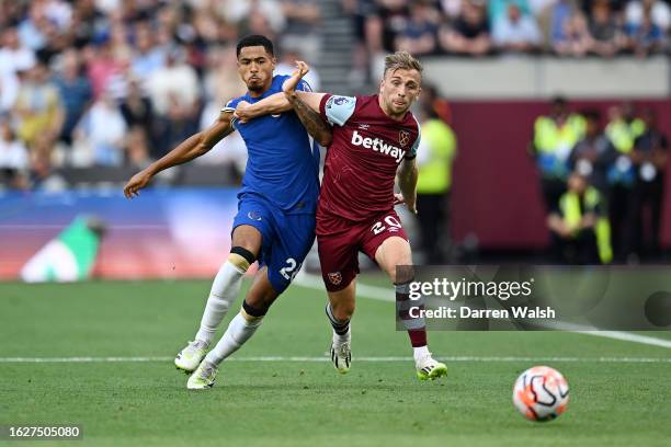 Levi Colwill of Chelsea and Jarrod Bowen of West Ham United battle for possession during the Premier League match between West Ham United and Chelsea...