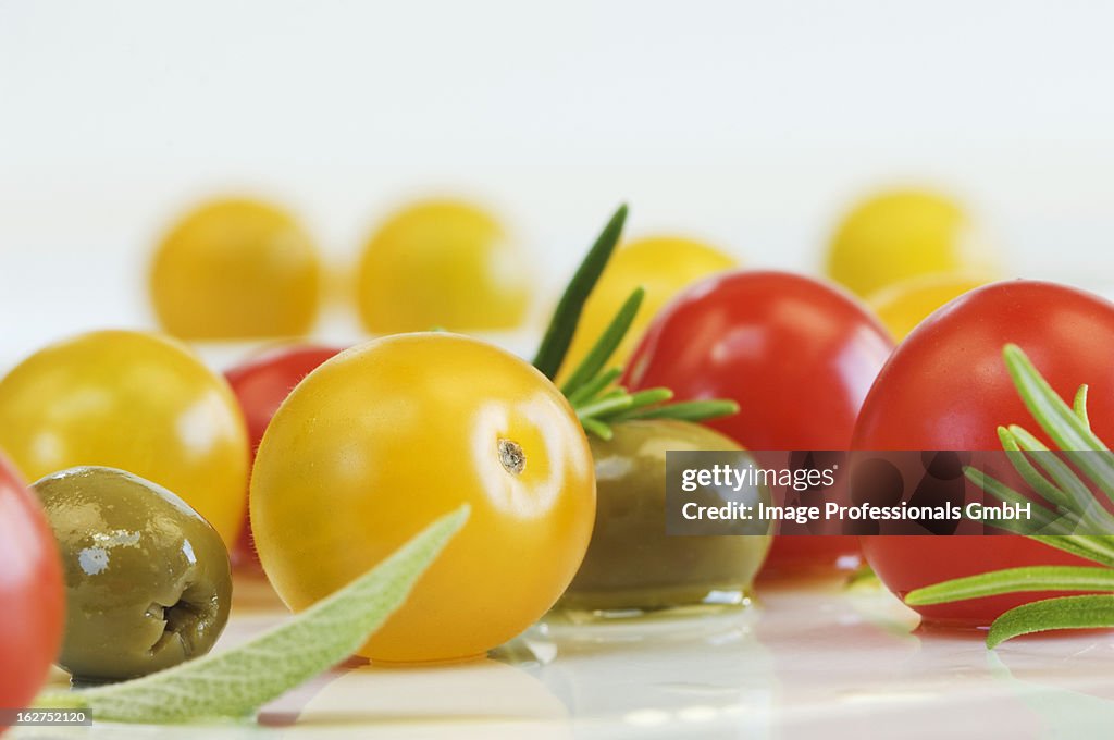 Cherry tomatoes, olives, sage and rosemary