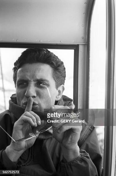 Gilbert Becaud On Winter Sports. En fevrier 1958, le chanteur francais Gilbert BECAUD passe des vacances aux sports d'hiver. Ici, sur un remonte...