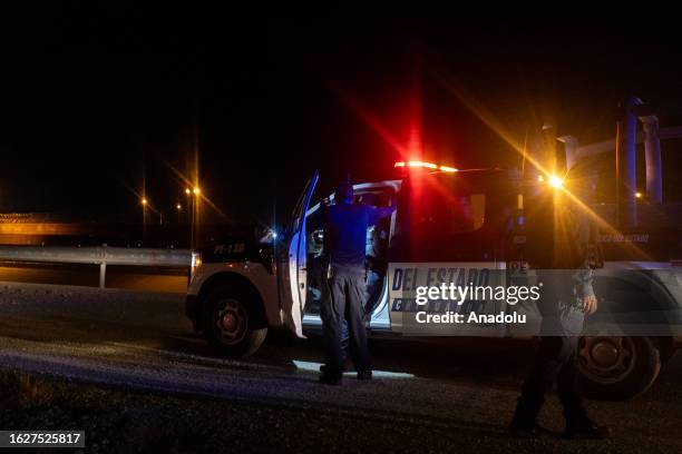 Patrol police take security measures around the scene as border guard shoots a man passing through the area on the border between Mexico and United...