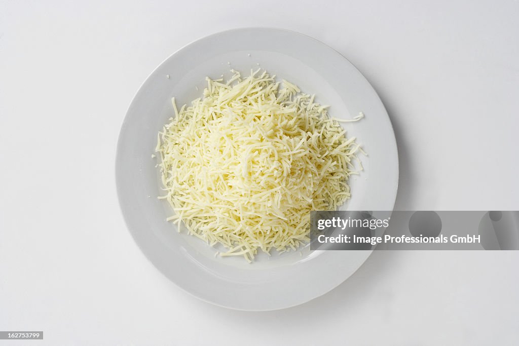 Plate of grated cheese, overhead view