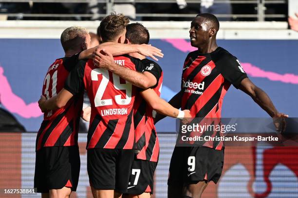 Randal Kolo Muani of Eintracht Frankfurt celebrates with his teammates after scoring the team's first goal during the Bundesliga match between...