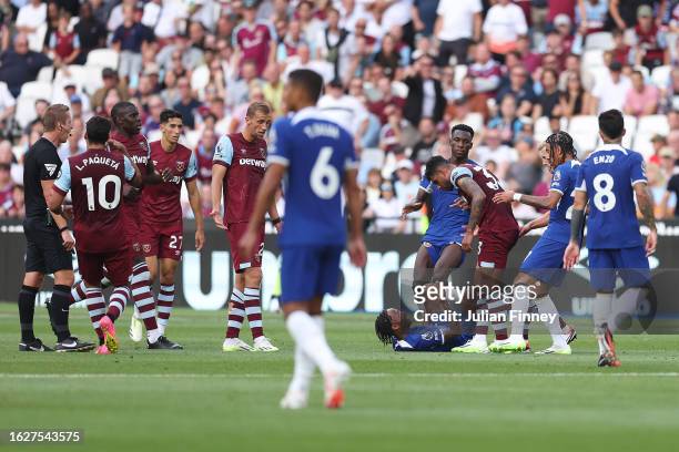 Emerson Palmieri of West Ham United clashes with Raheem Sterling of Chelsea after a penalty is awarded to Chelsea during the Premier League match...