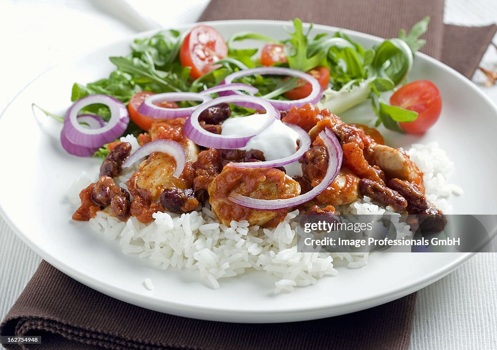 Chicken chilli with taco sauce on bed rice