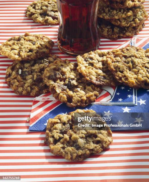 raisin cookies with cola - raisin cookie stock pictures, royalty-free photos & images
