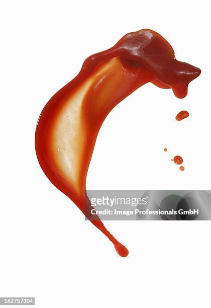 squirted tomato sauce against white background - sauce stock pictures, royalty-free photos & images