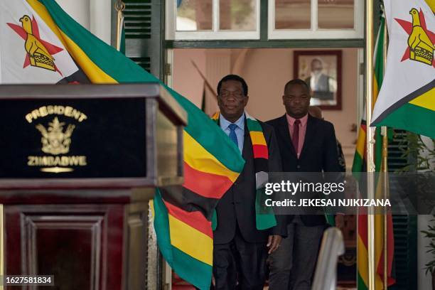 President of Zimbabwe Emmerson Mnangagwa arrives for a press conference at State House in Harare on August 27, 2023. Zimbabwe's President Emmerson...