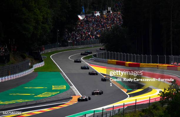 Nico Hulkenberg of Germany driving the Haas F1 VF-23 Ferrari chases Zhou Guanyu of China driving the Alfa Romeo F1 C43 Ferrari on track during the F1...