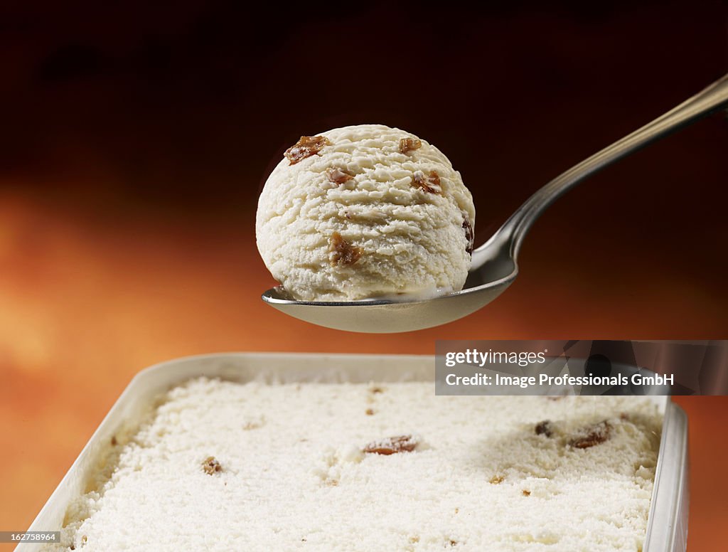 Scoop of walnut ice cream on spoon