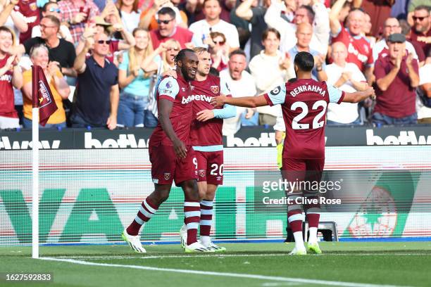 Michail Antonio of West Ham United celebrates with teammates Jarrod Bowen and Said Benrahma after scoring the team's second goal during the Premier...
