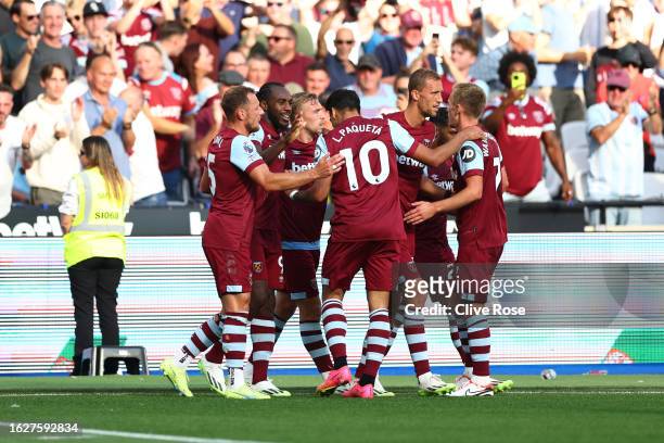 Michail Antonio of West Ham United celebrates with teammates after scoring the team's second goal during the Premier League match between West Ham...