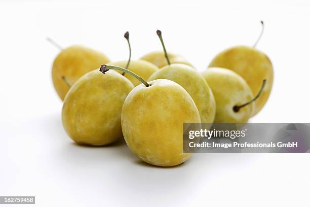 mirabelle on white background - mirabelle plum stock pictures, royalty-free photos & images