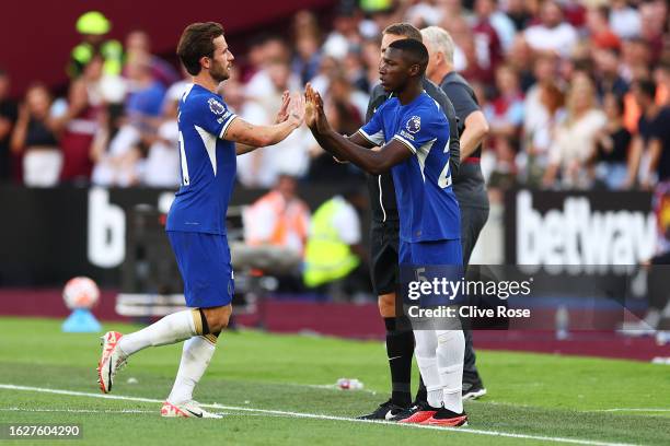 Moises Caicedo of Chelsea is substituted on for teammate Ben Chilwell during the Premier League match between West Ham United and Chelsea FC at...