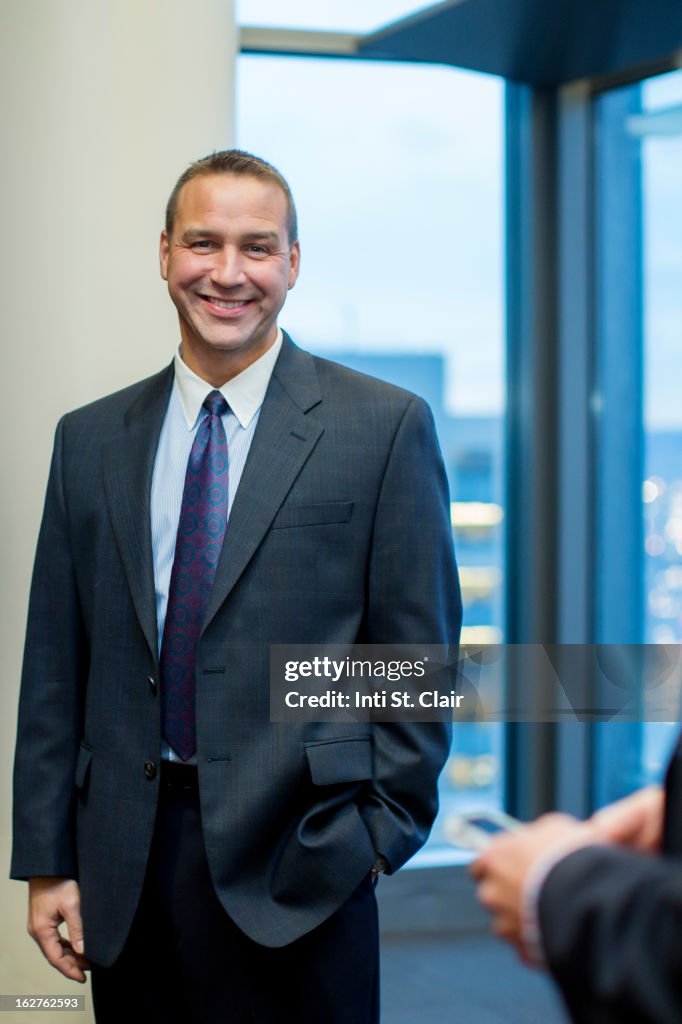 Portrait of smiling business man in suit