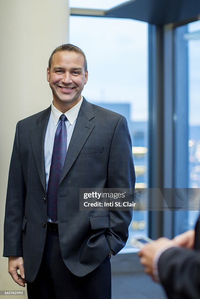 Portrait of smiling business man in suit