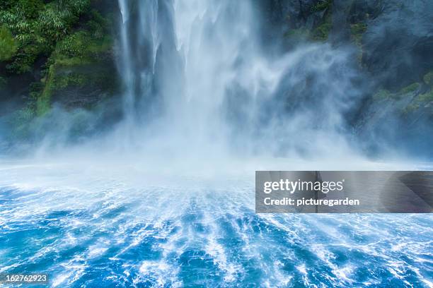 waterfall dropping into fjord - pure stock pictures, royalty-free photos & images